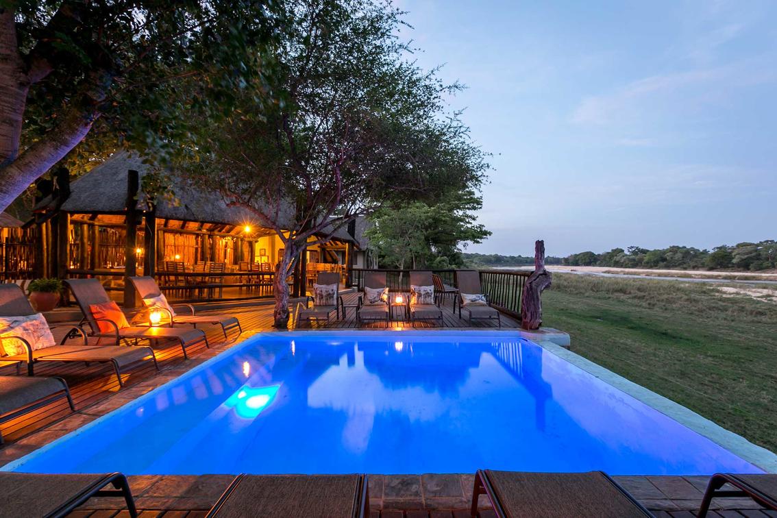 The pool at sunset at Umkumbe Safari Lodge